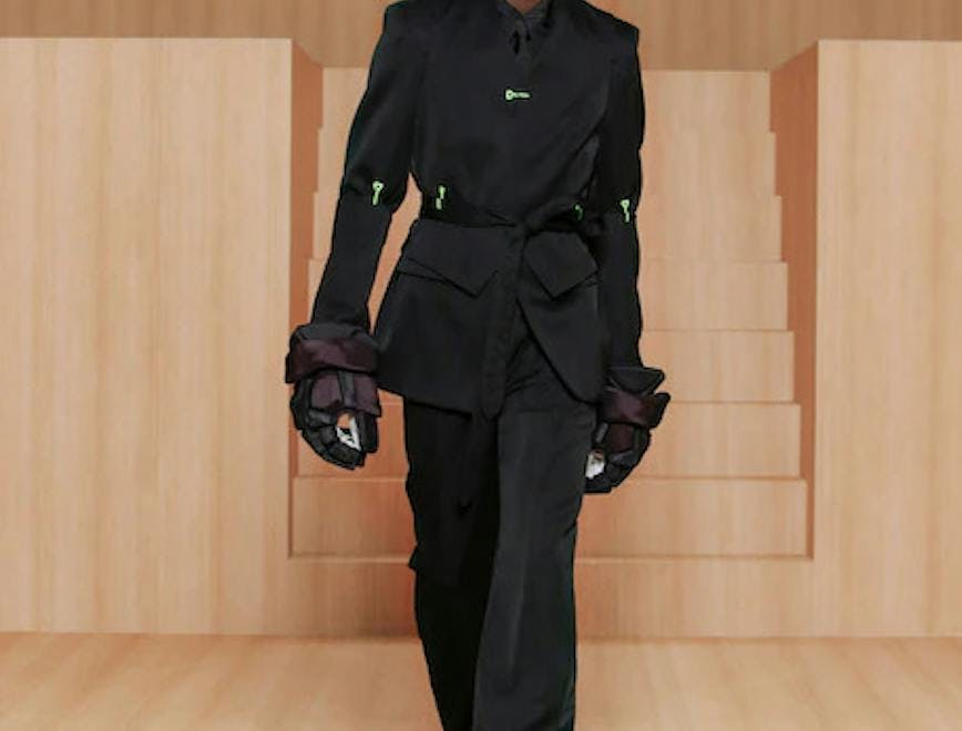 clothing apparel person human hat suit coat overcoat