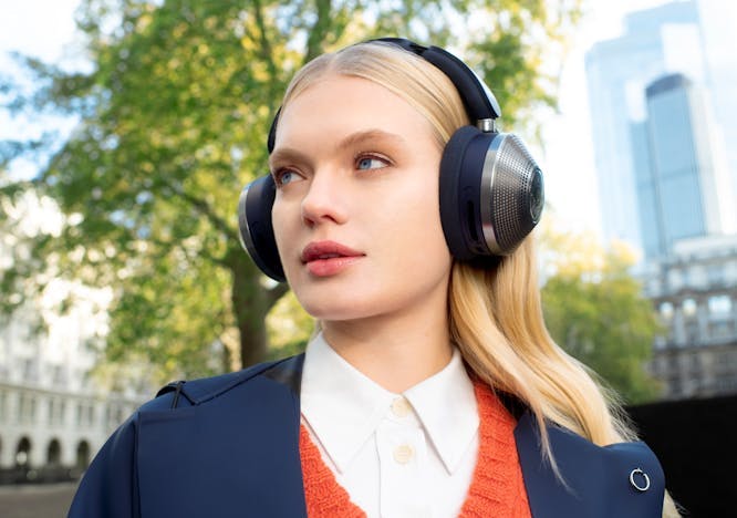 woman adult female person blonde hair headphones electronics coat clothing