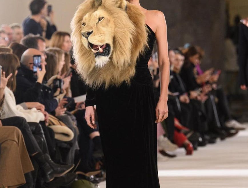 person woman adult female fashion dress clothing formal wear lion wildlife