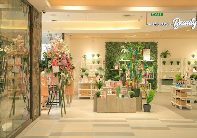 shop shopping mall flower flower arrangement plant flower bouquet person floor flooring shoe