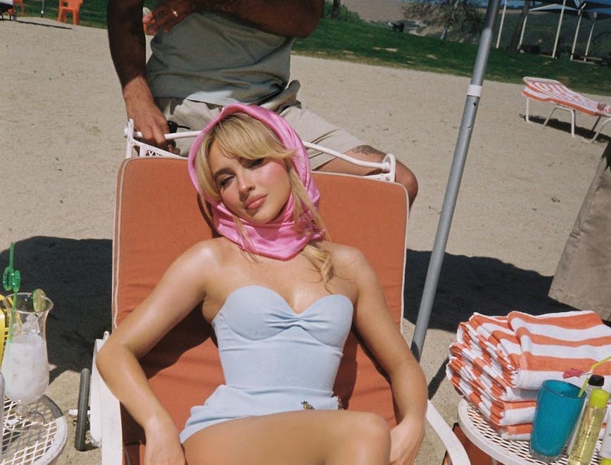 adult female person woman sunbathing face head furniture